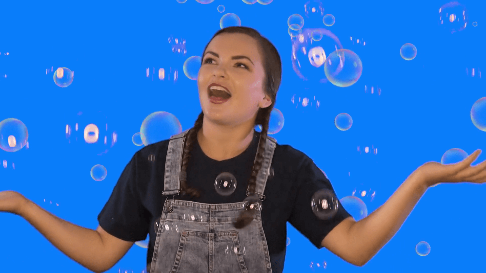 Kiki sings in Kiki's Music Time music video for toddlers on KneeBouncers, bubble popping song